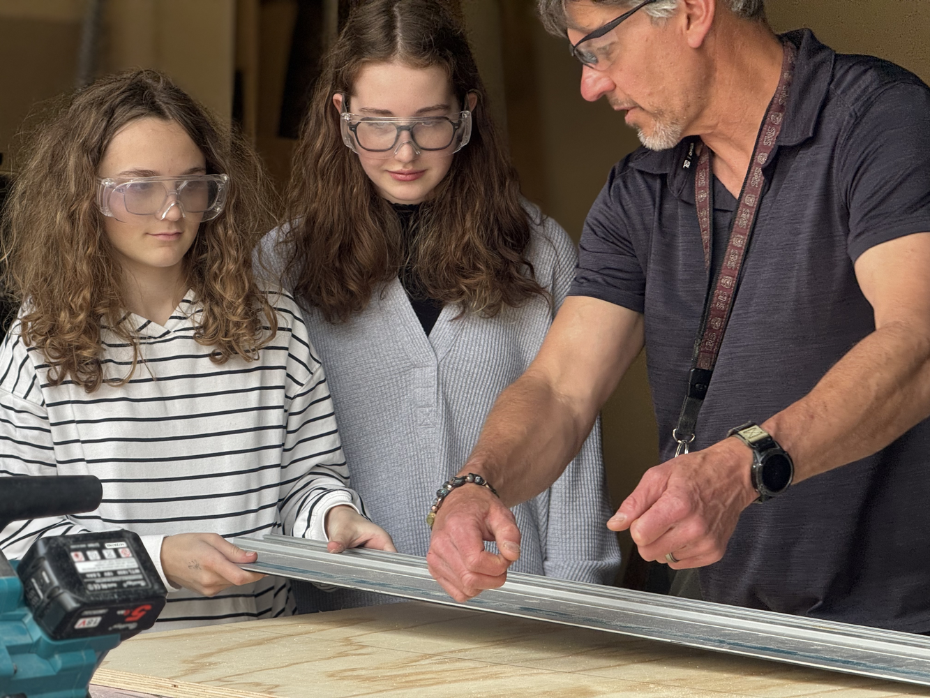 Walter Luther instructs students on a project in the Cube - STEM Lab.